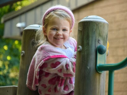 Girl on playground at the Hingham Early Learning Center.