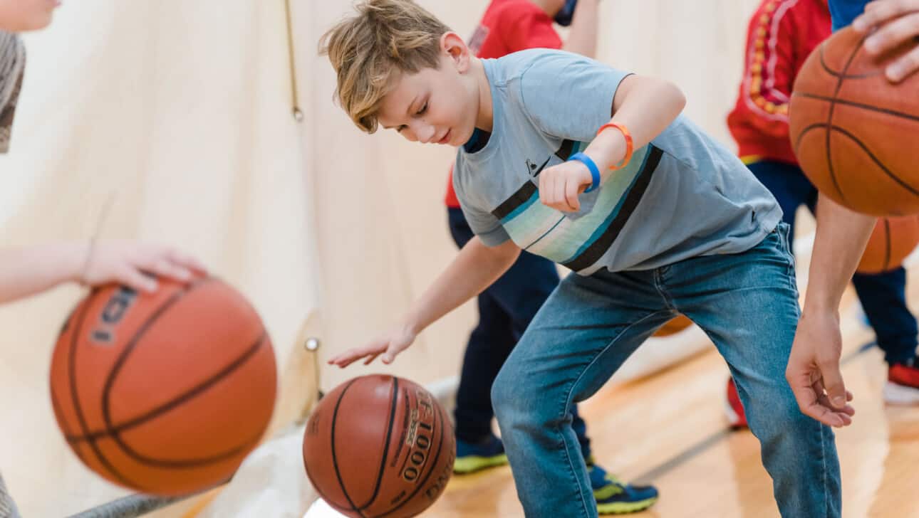 Boy playing basketball.