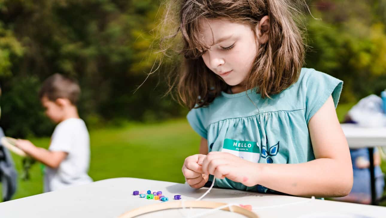 Girl doing a craft.