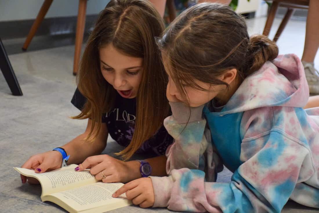 girls reading together.