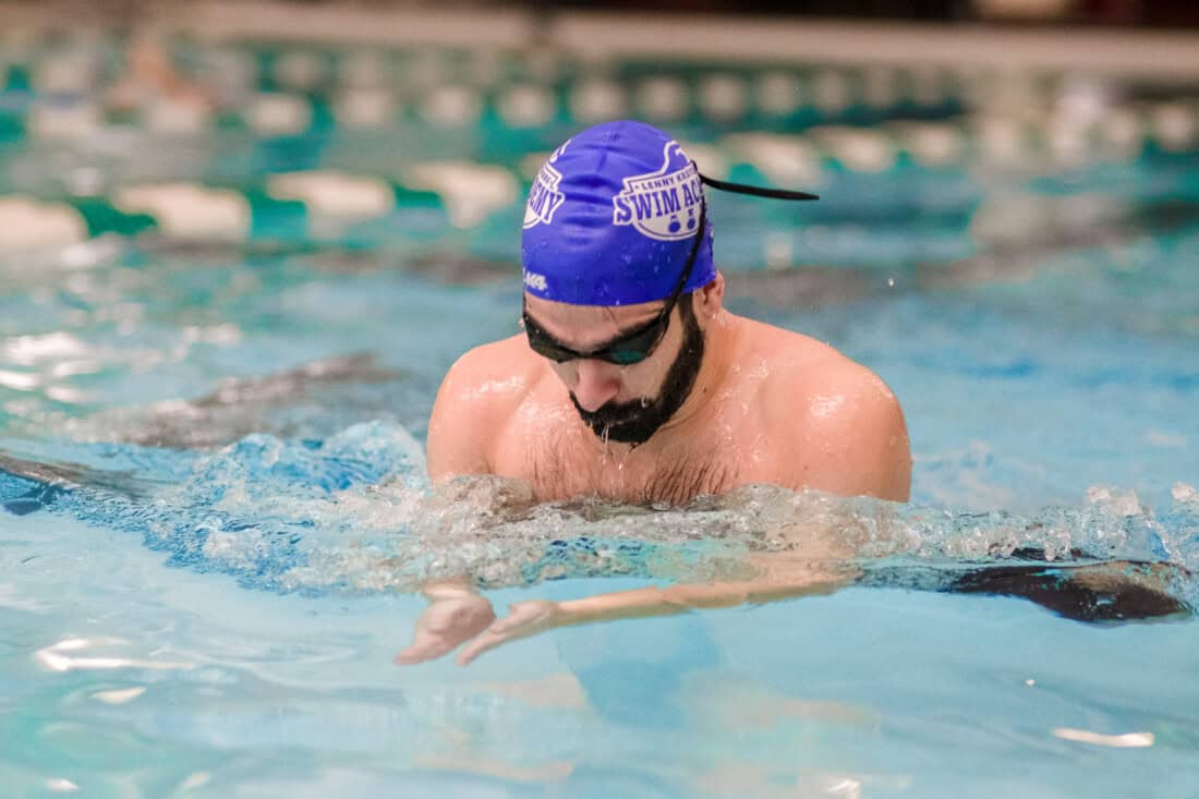 Man taking swim lessons.