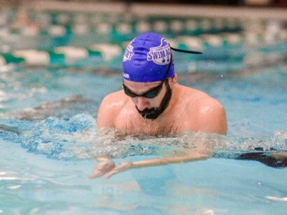 Man taking swim lessons.