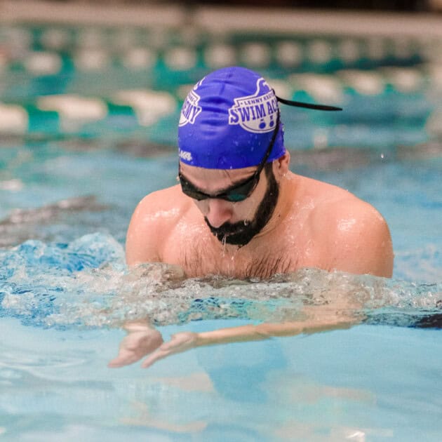 Man taking swim lessons.