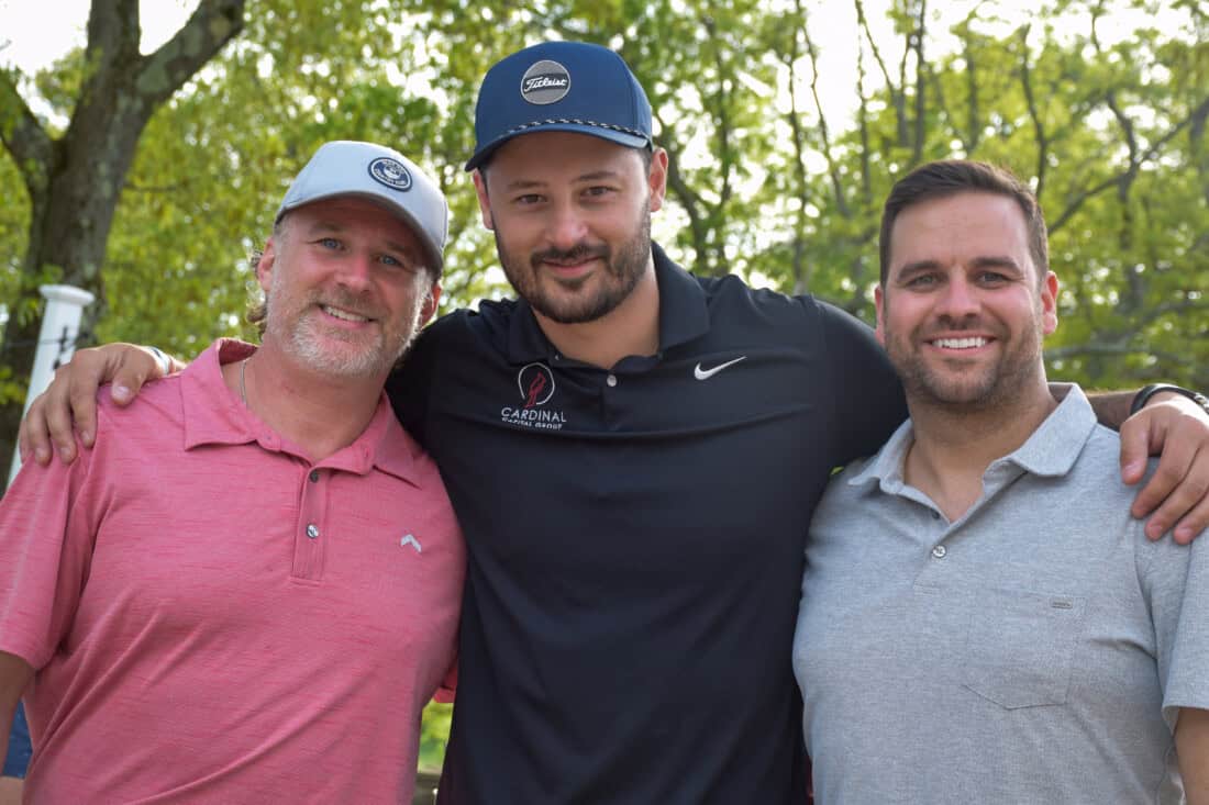 Guys enjoying the golf benefit.